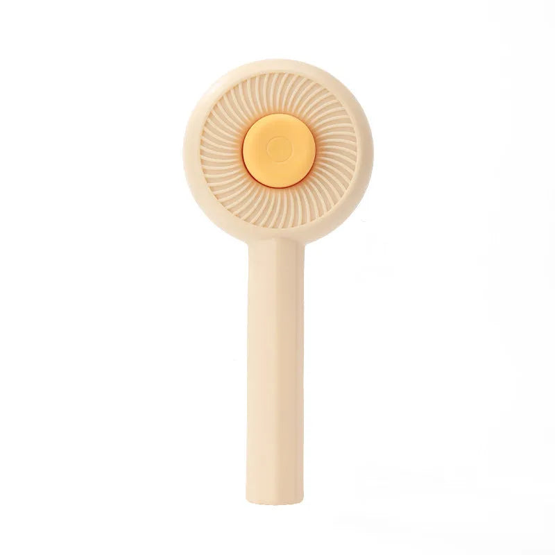 Blue and yellow pet grooming brush with metal pins and a self-cleaning button