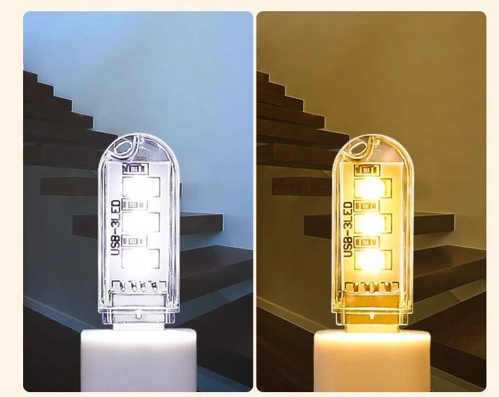 Small cylindrical USB baby night light showing warm yellow glow on a dark background.
