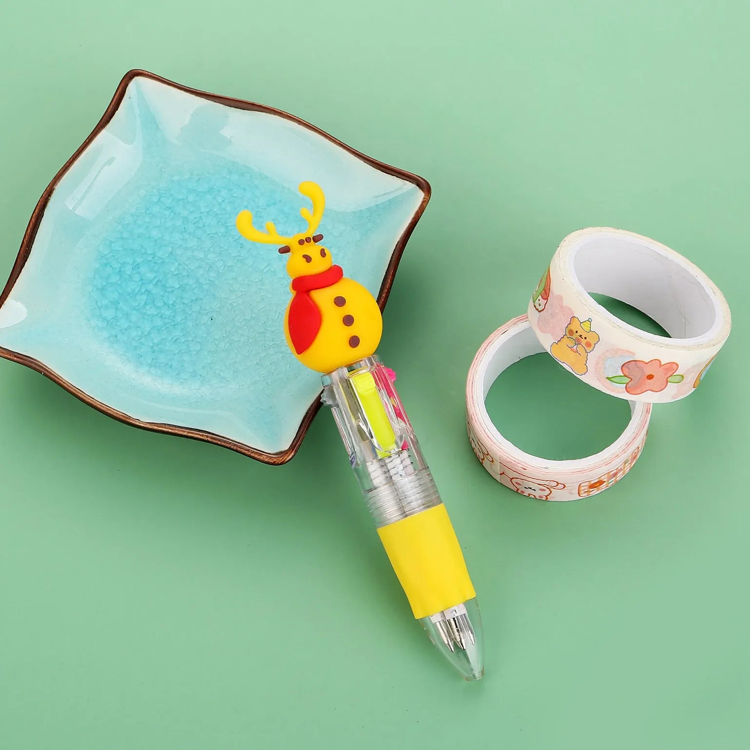 Compact 11cm Christmas four-colour press pen with festive designs including reindeer and snowmen.