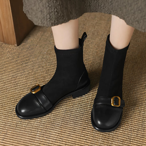 Black women's low heel Martin ankle boots with front lace-up and metal buckle detail on a white background.