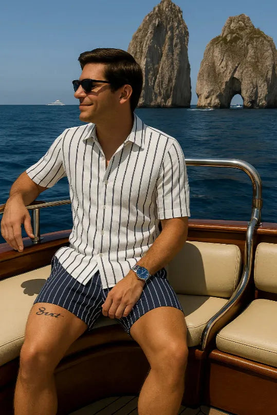 Men's light blue beach shirt and matching shorts set laid flat