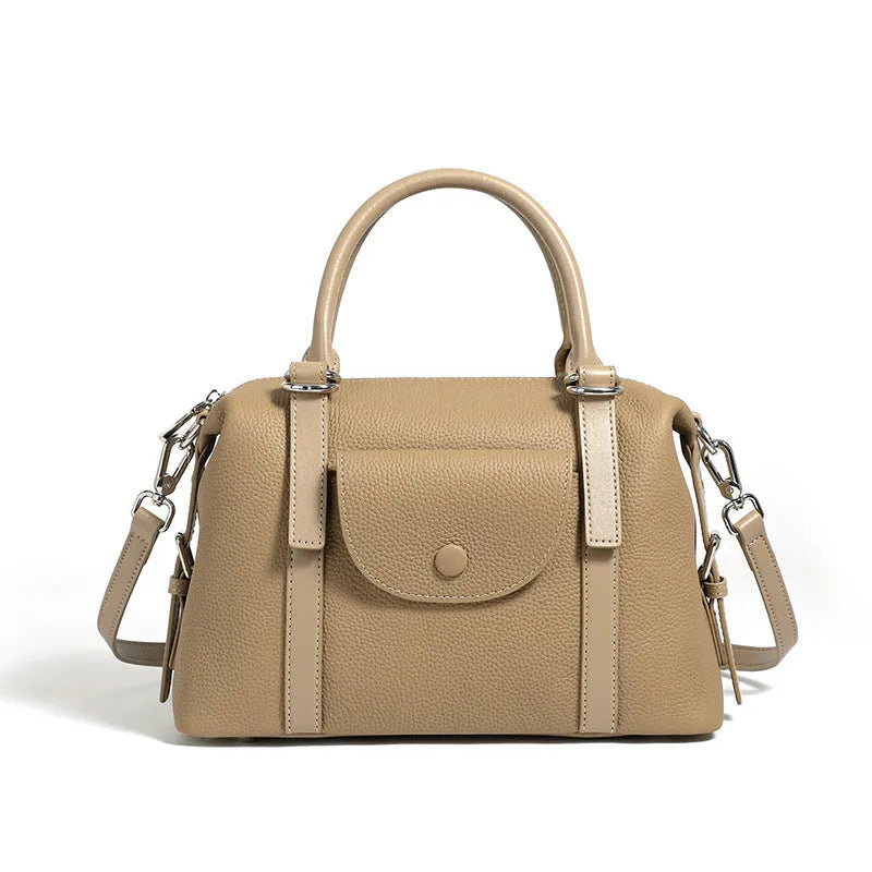 Genuine leather ladies handbag with contrast stitching and lock detail in street style