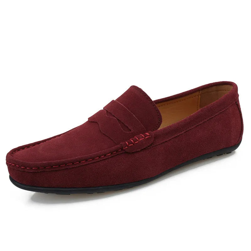Men's suede slip-on loafers in a solid colour with a round toe and flat rubber sole.