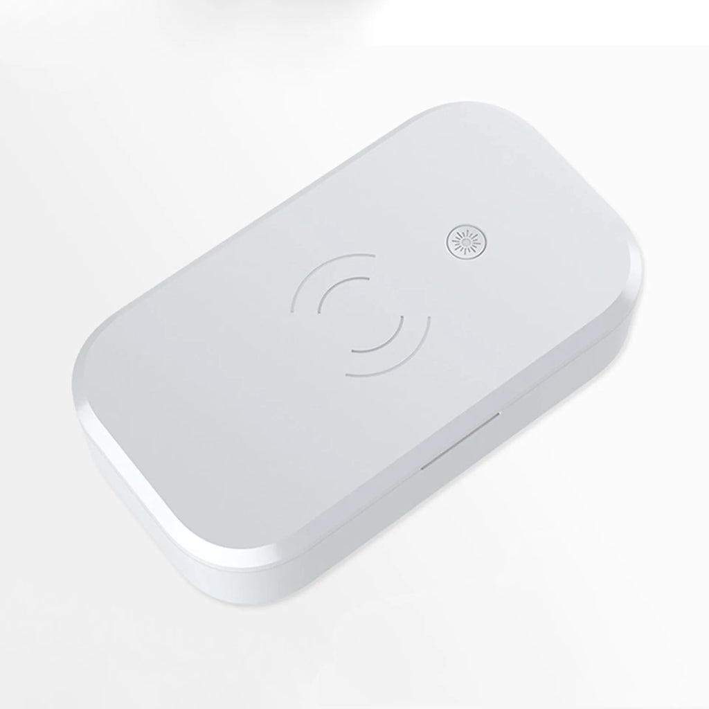 White ultraviolet disinfection box with wireless charging pad for nail tools and mobile phones