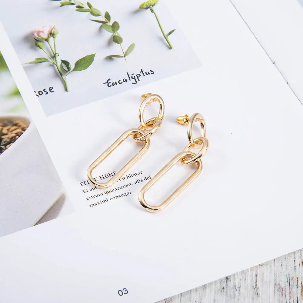 Geometric sterling silver needle colour hoop earrings for women with an alloy construction.