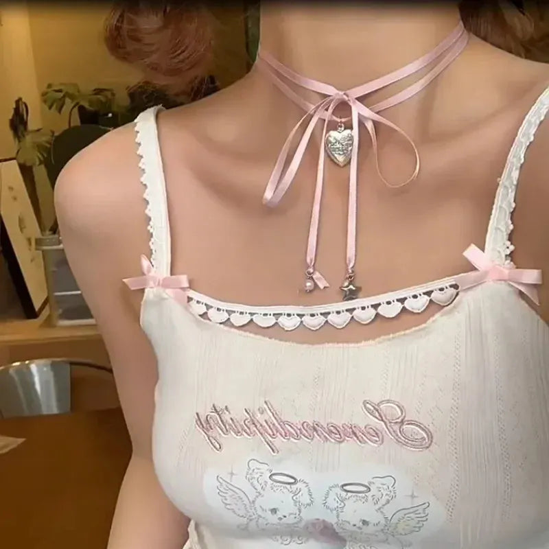 Women's ribbon pendant necklace with alloy chain and electroplated finish showing clavicle length