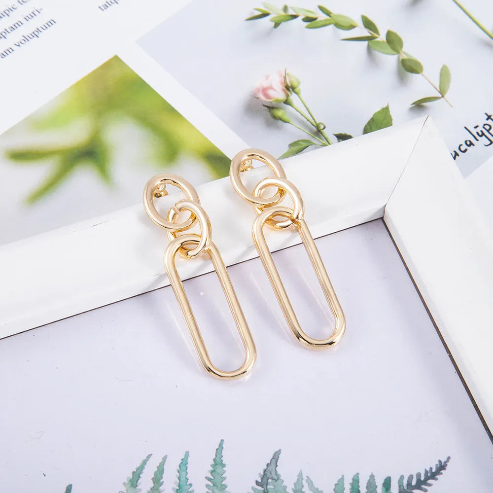 Geometric sterling silver needle colour hoop earrings for women with an alloy construction.