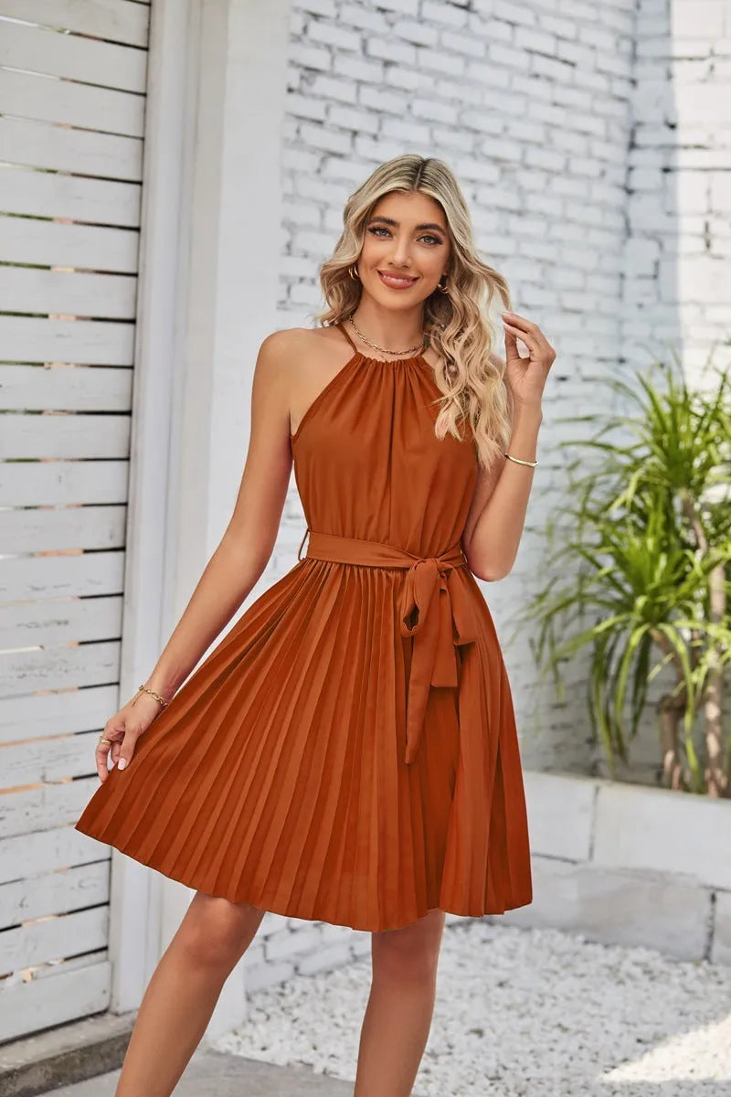 Women's black halter-neck strapless chiffon dress with pleated midi skirt and adjustable waist belt