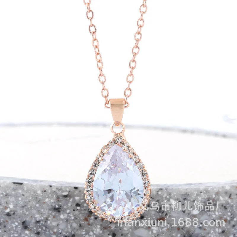 Drop shape geometric pendant necklace with rhinestone inlay in pink rose gold electroplated finish