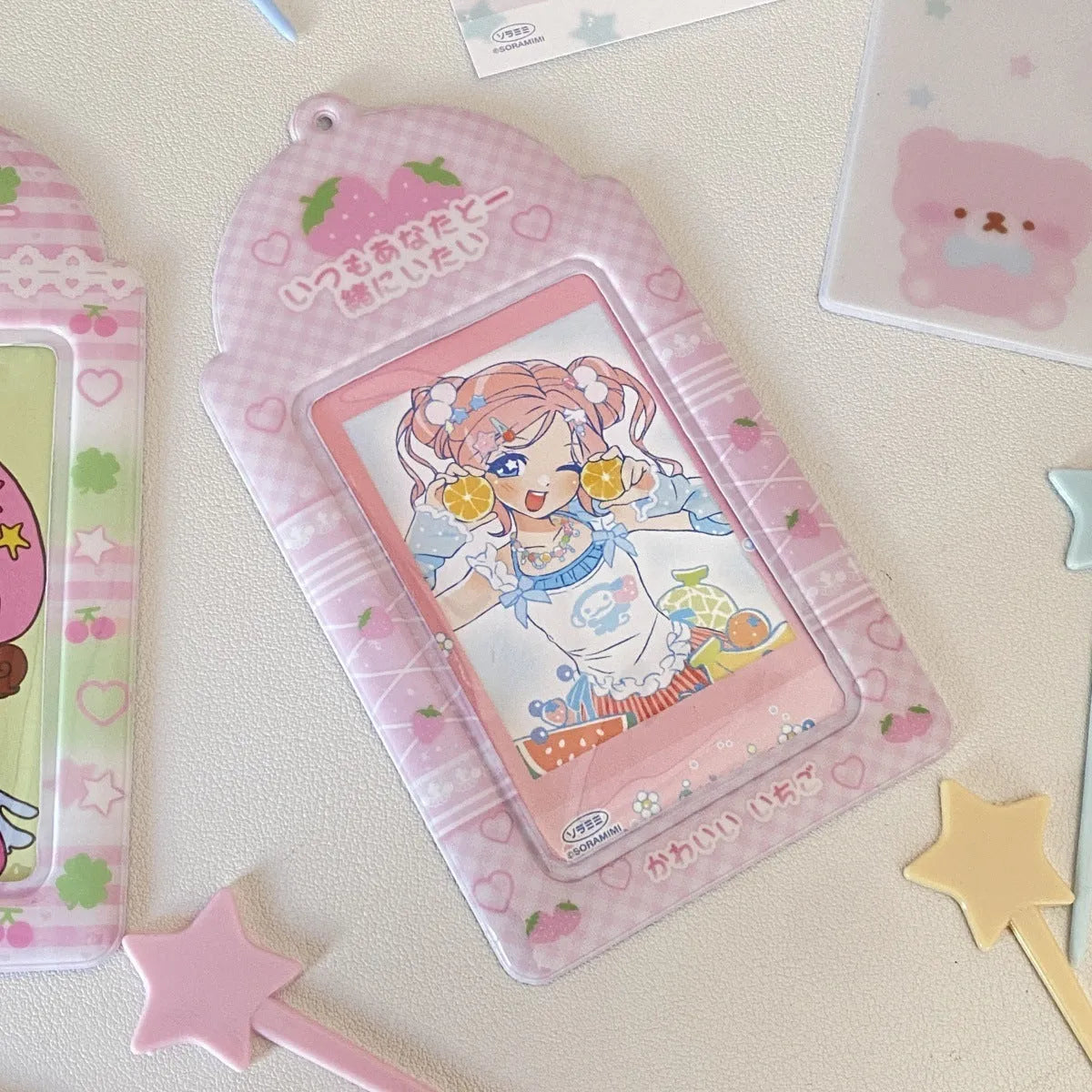 Cartoon strawberry and four-leaf clover PVC card holder pendants for ID and meal cards.
