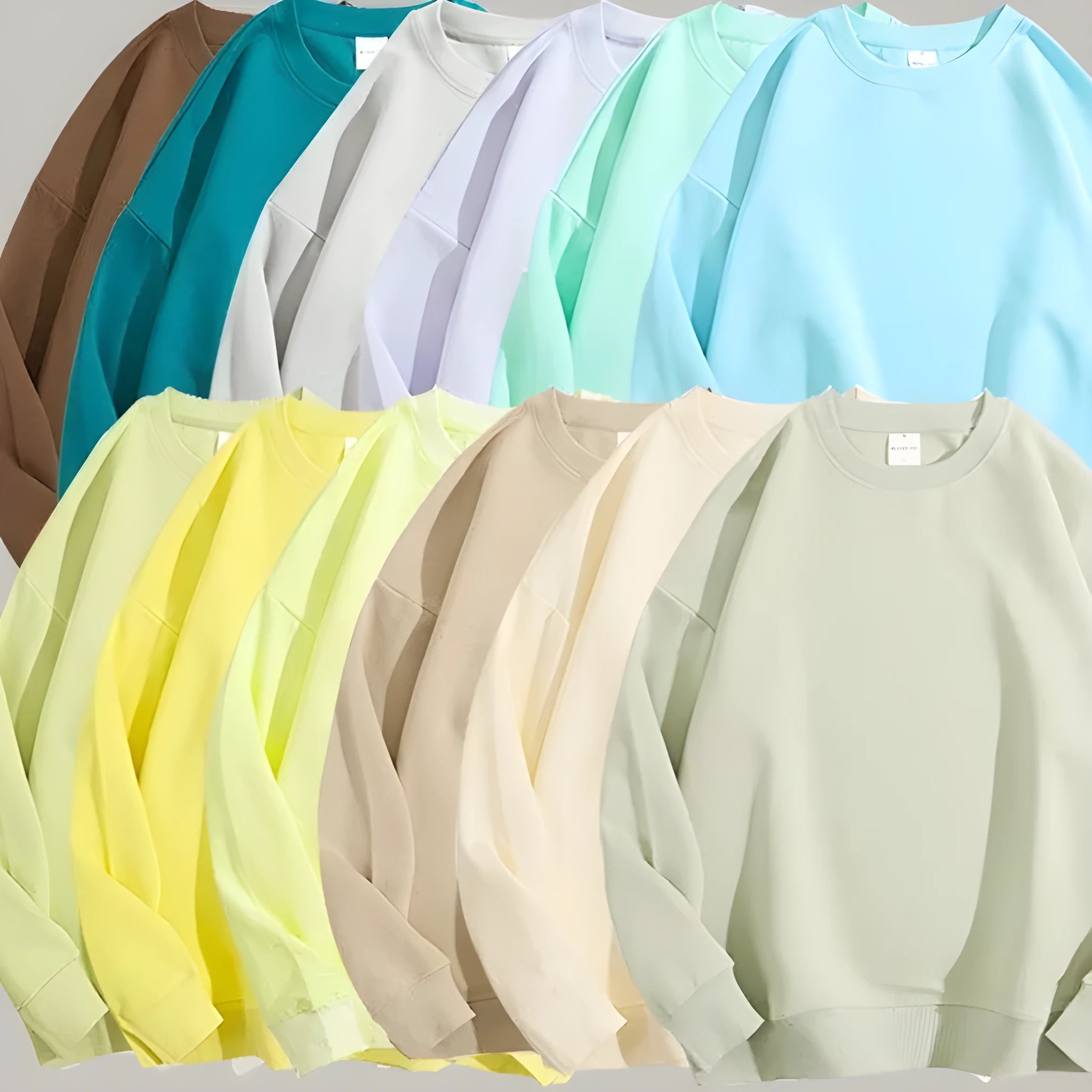 A loose round neck off shoulder pullover sweater in a solid colour, with long sleeves.