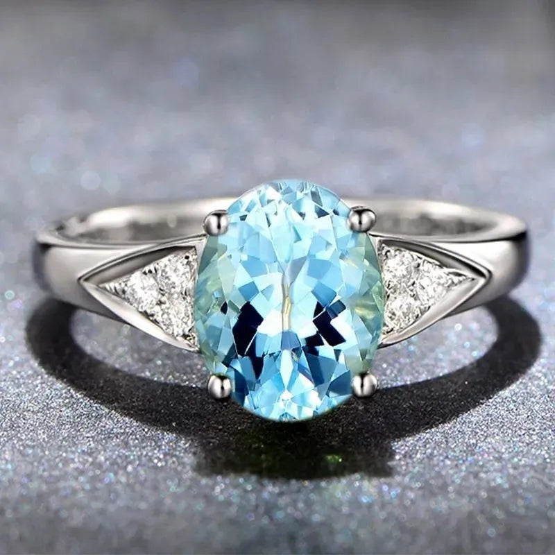 Women's zircon ring with natural stone in a court setting, showing heart, water drop, and bell pattern options.