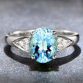 Women's zircon ring with natural stone in a court setting, showing heart, water drop, and bell pattern options.
