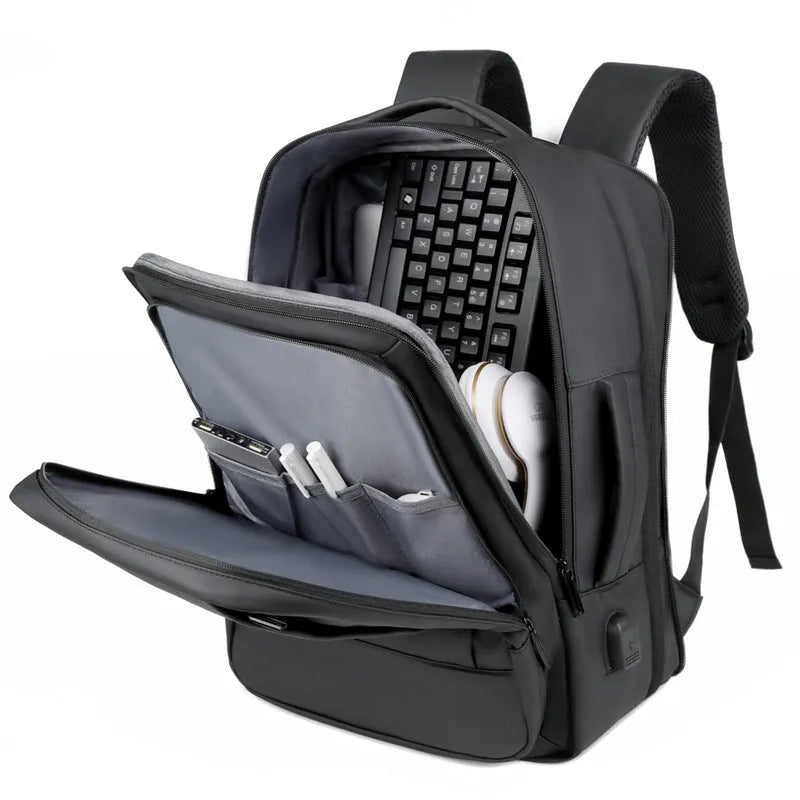 Large capacity waterproof backpack in black or grey Oxford cloth with curved shoulder strap and hand-carry handle