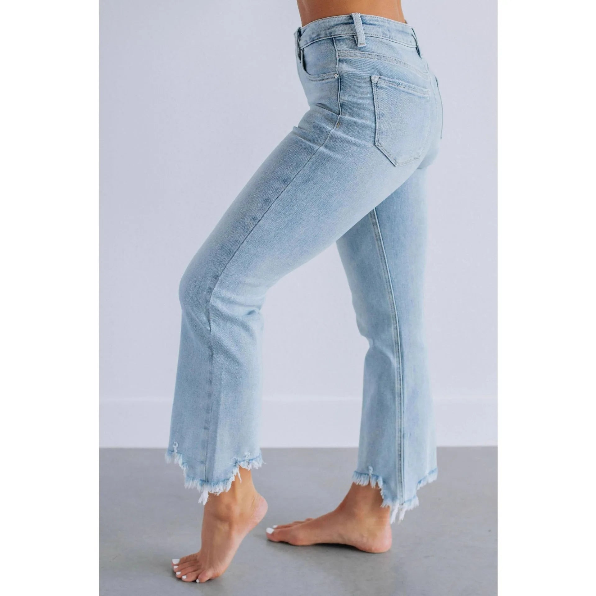 Women's solid colour denim jeans with hand-worn detailing in dark blue and light blue options