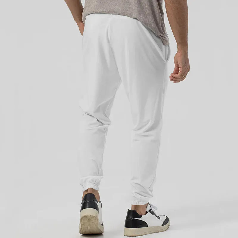 Men's grey cotton blend track sweatpants with straight-leg design and mid waist