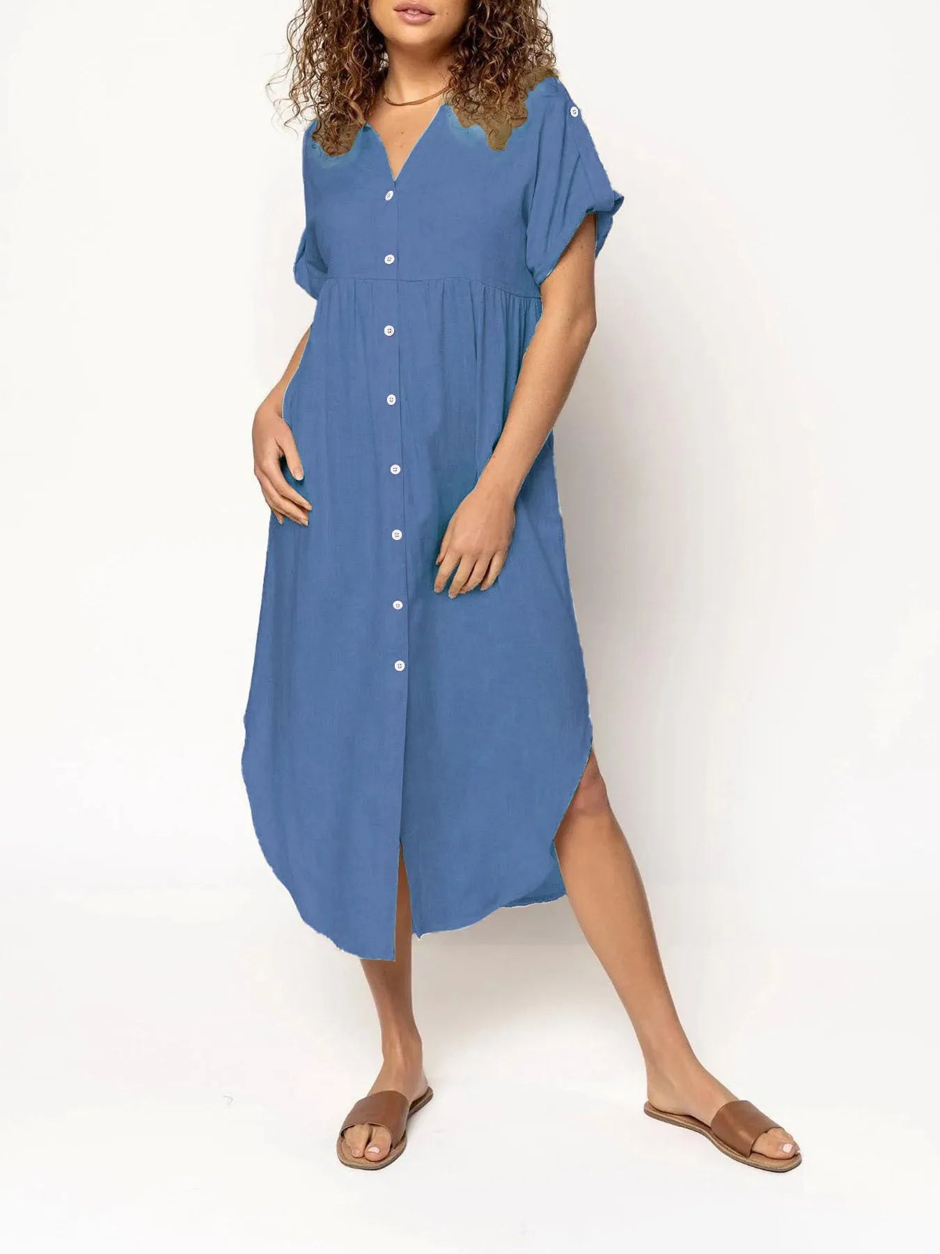 A loose-fitting, solid colour mid-length casual dress with a button-down front and regular sleeves.