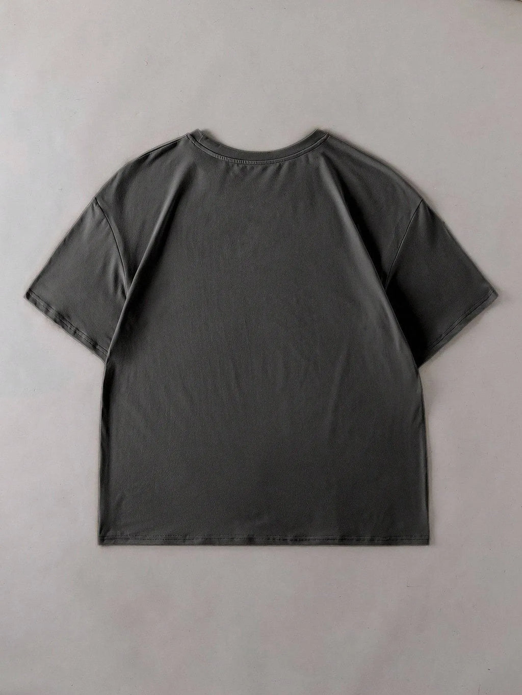 Straight-fit round neck cotton t-shirt in black, green, grey, or orange, shown with short sleeves.