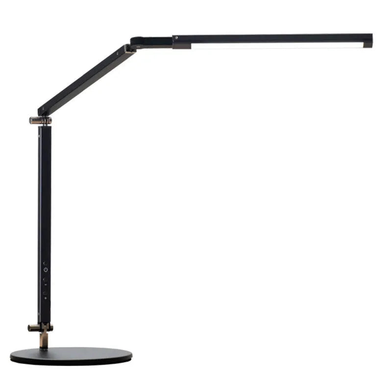Black adjustable clip-on desk lamp with flexible arm and remote control on a wooden desk