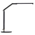 Black adjustable clip-on desk lamp with flexible arm and remote control on a wooden desk