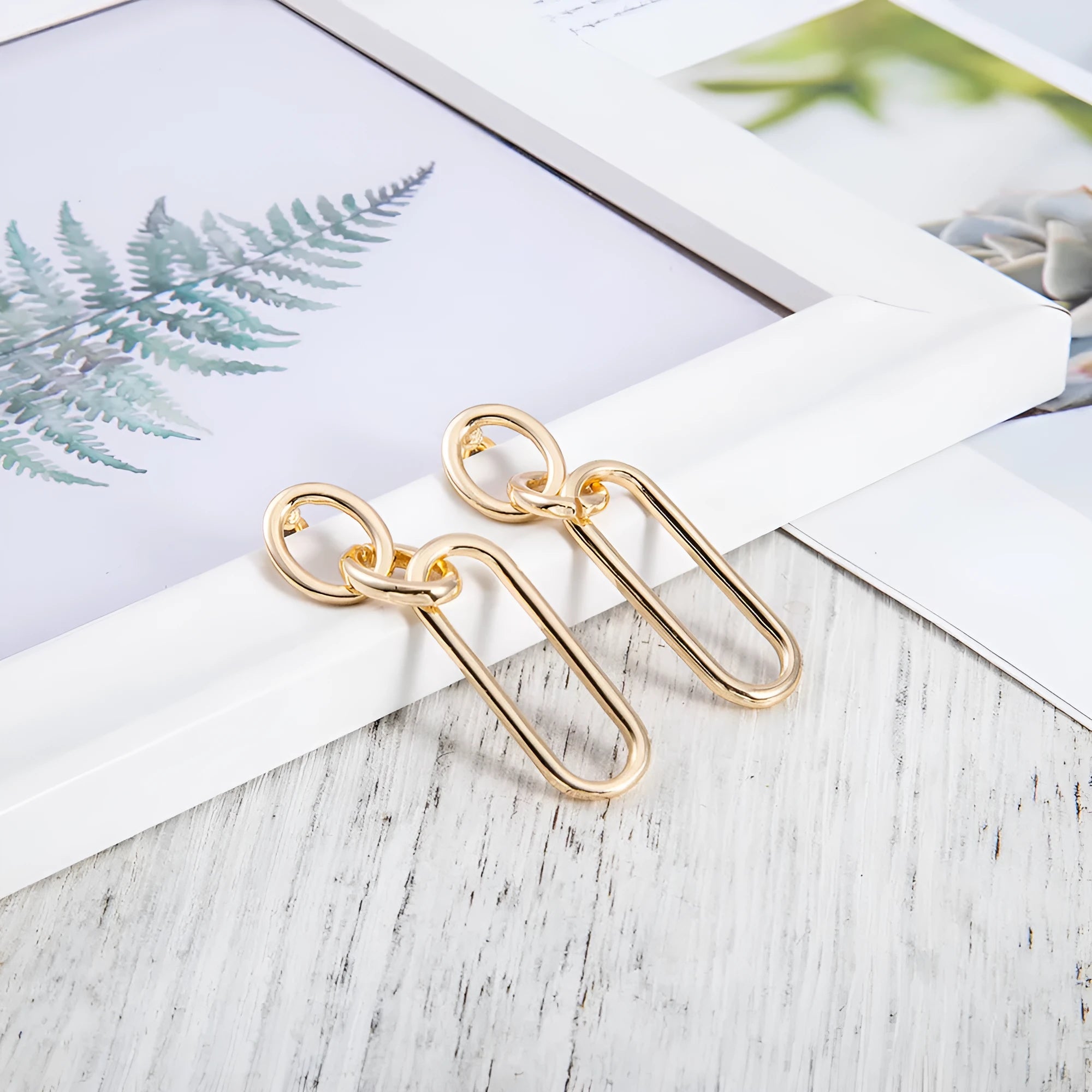 Geometric sterling silver needle colour hoop earrings for women with an alloy construction.