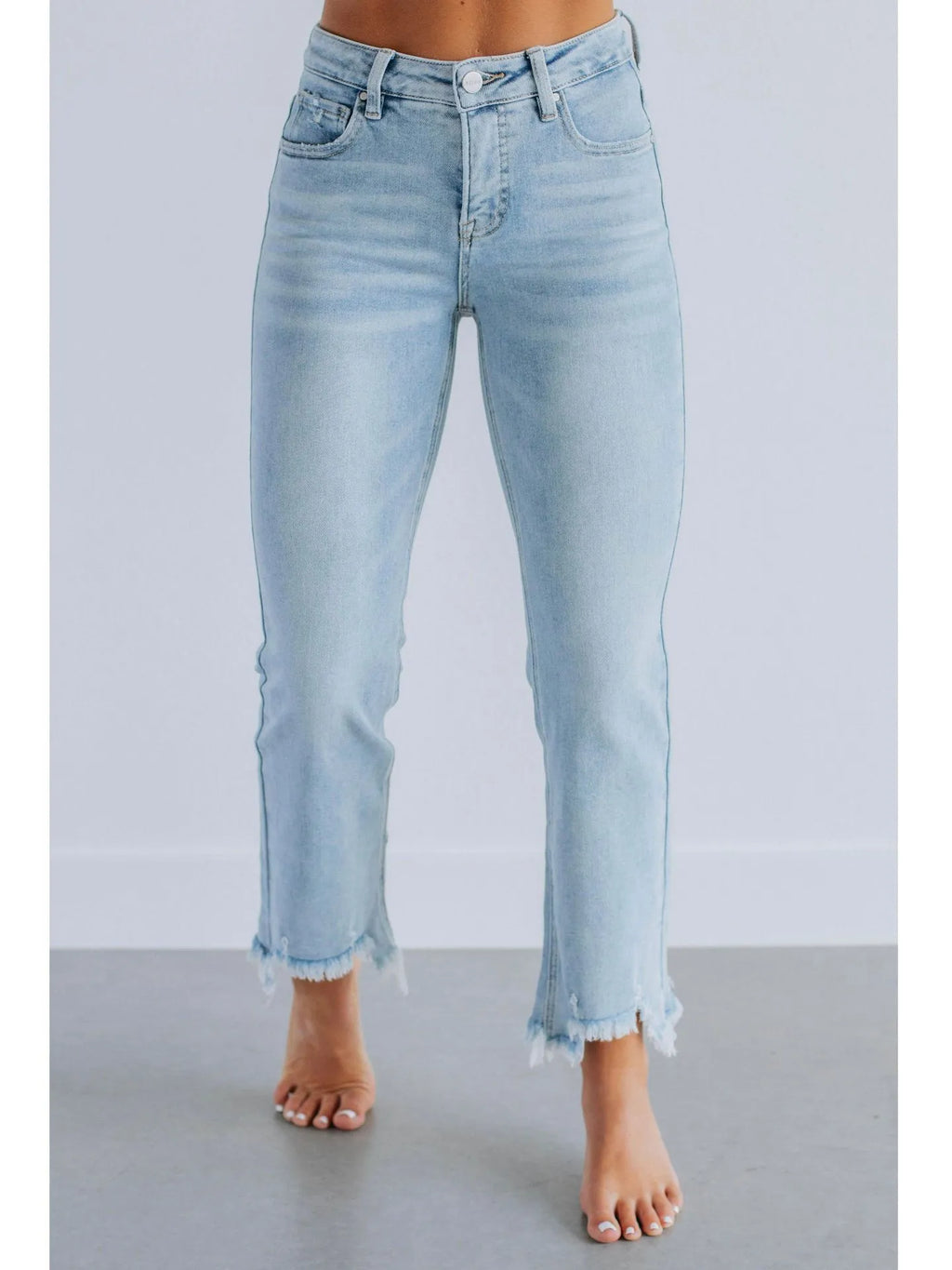 Women's solid colour denim jeans with hand-worn detailing in dark blue and light blue options