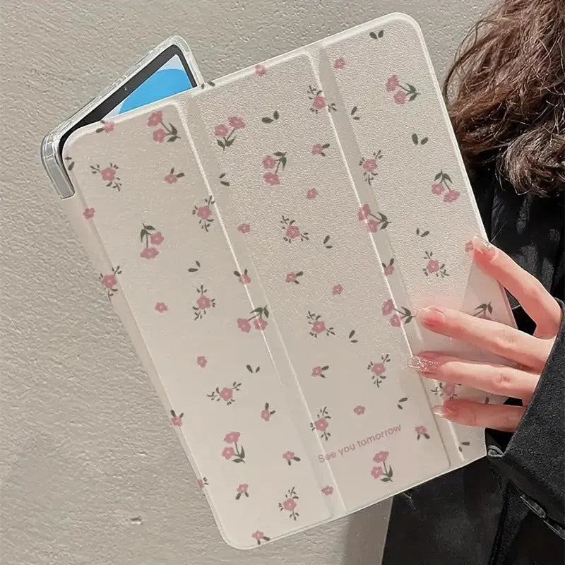 Clear tri-fold iPad case with floral design, shown in stand mode.