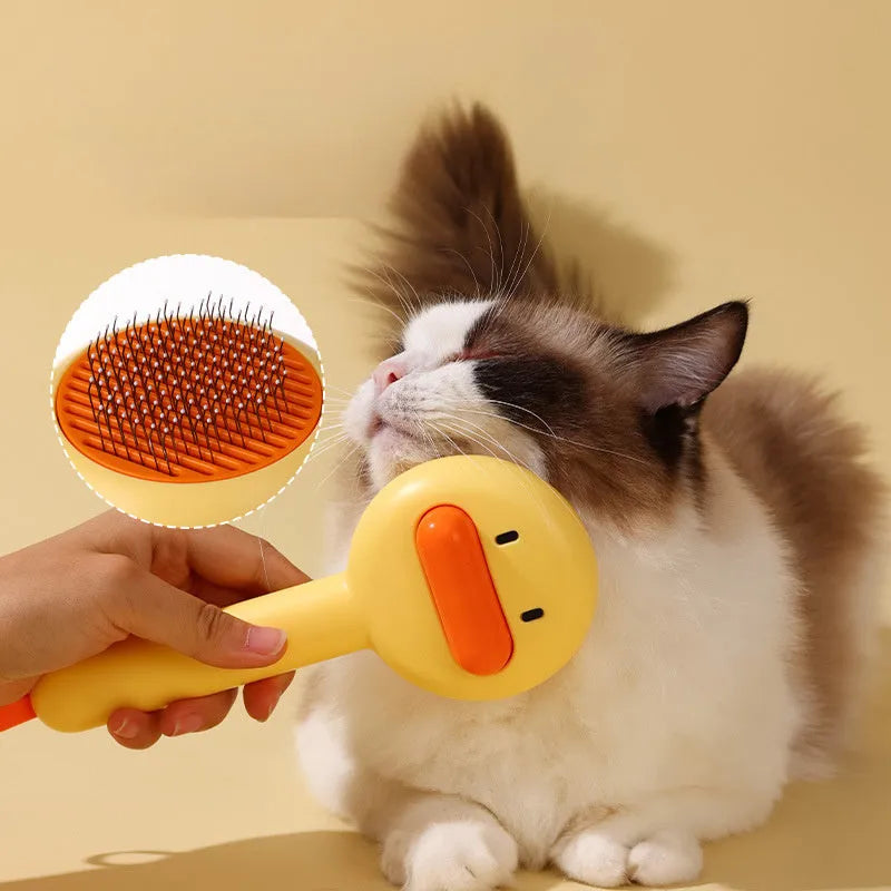 Small yellow duck-shaped pet grooming comb with open section design and needle pins for hair removal