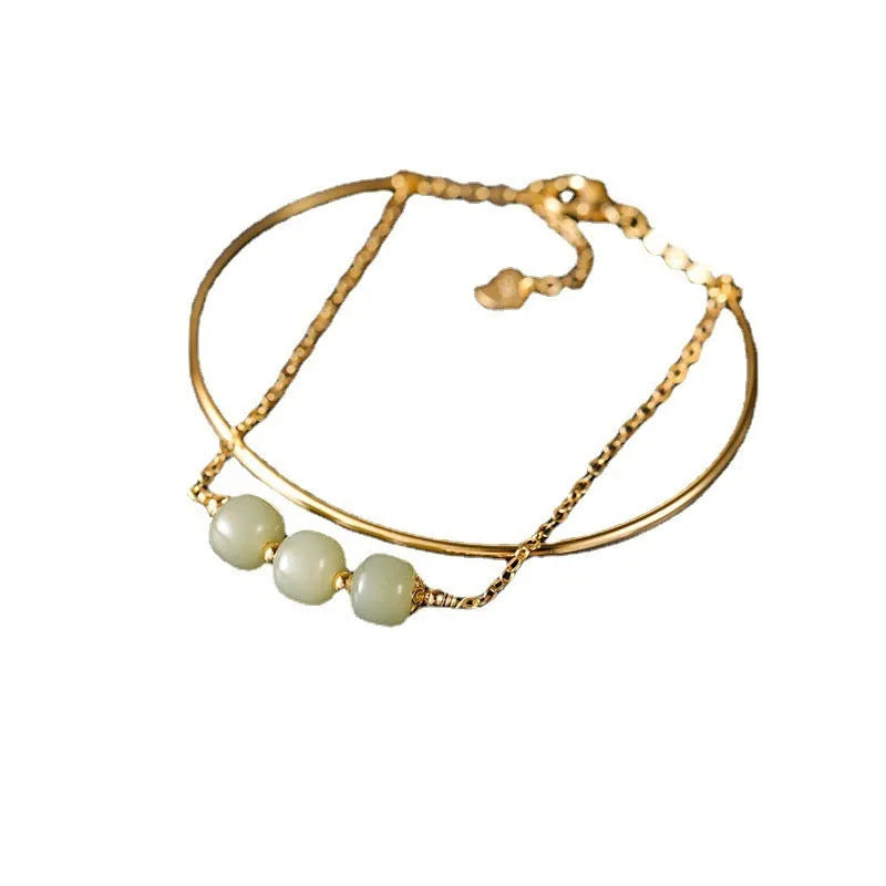 Women's Hetian jade bead bracelet with gold inlay detailing in single, double and three bead versions