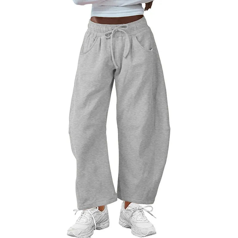 Loose cropped sweatpants with drawstring waist and side pockets in European street style