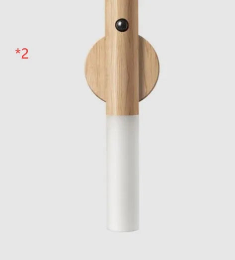 Compact wooden and acrylic motion sensor LED desk lamp on a desk