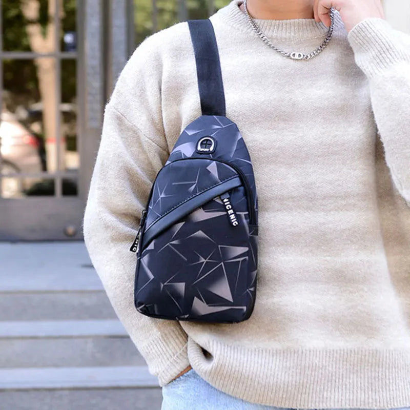 Blue print sling chest bag with a crossbody strap, showing the earphone hole and zipper opening.