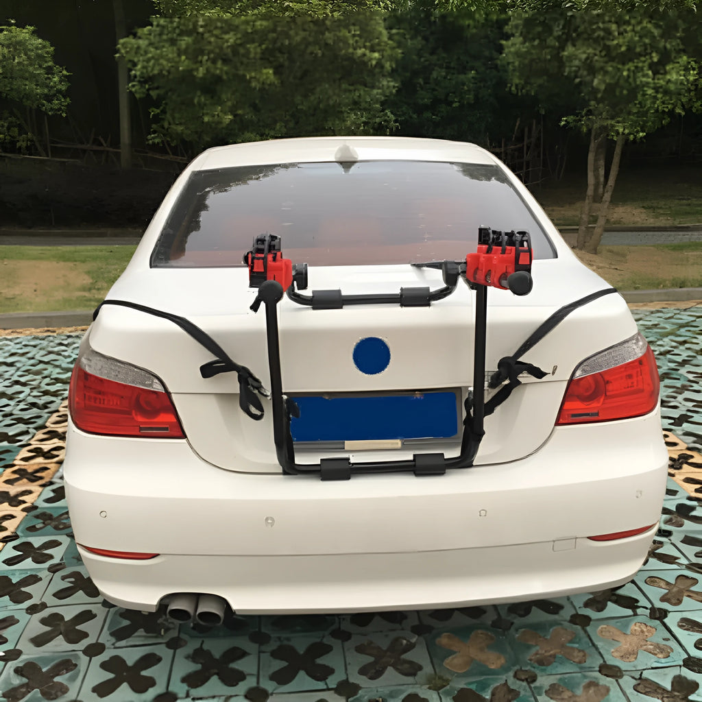 Black and red trunk mounted car bike rack with sponge padding, showing either tie rope or pull belt fastening.