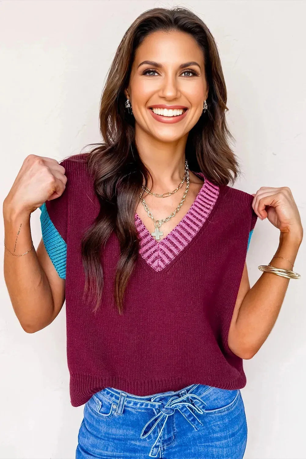 Burgundy women's loose V-neck sweater with white contrast trim and cuffed short sleeves