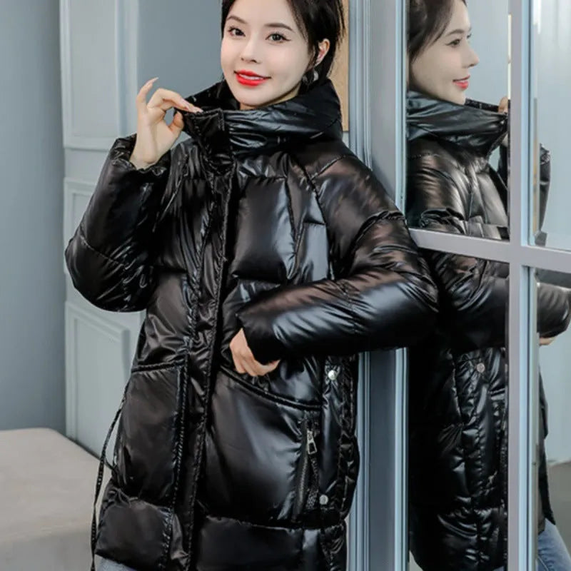 Women's loose thick hooded winter jacket in black, shown on a model.