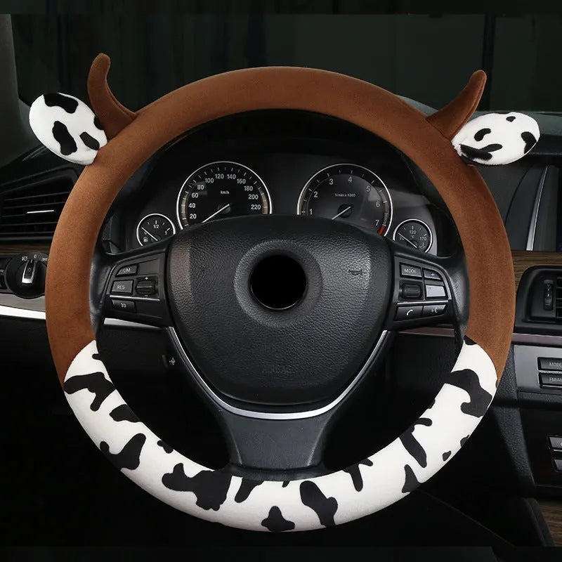 Black short plush car steering wheel cover shown on a vehicle steering wheel