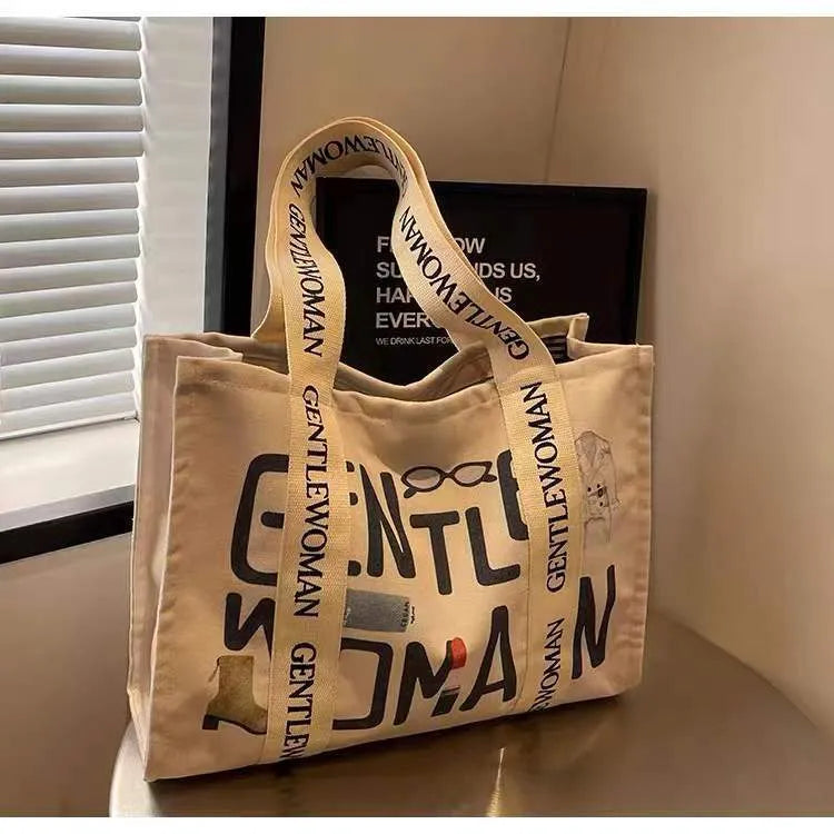 Canvas women's tote bag with printed letter or pattern designs and shoulder straps