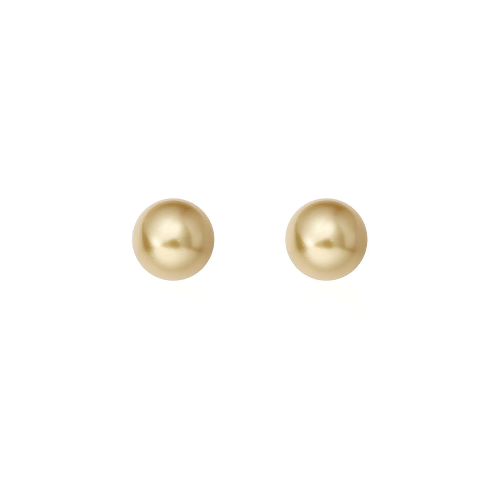 A pair of large geometric pearl stud earrings with an eight-point star detail on silver settings.