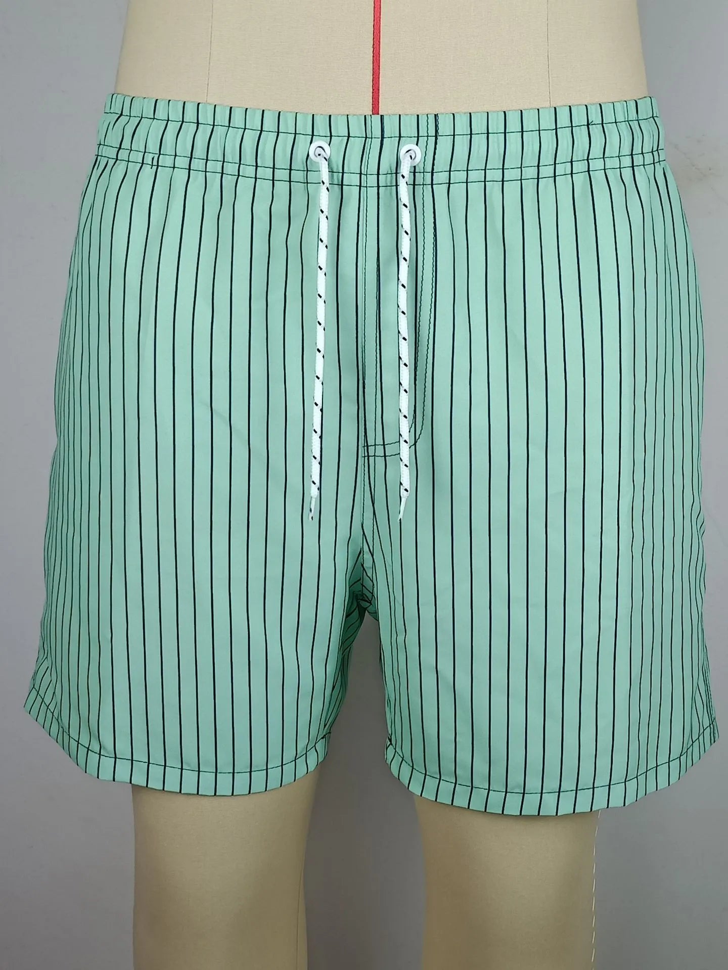 Polyester fibre striped beach shorts in navy blue, grey, khaki, or light blue colours
