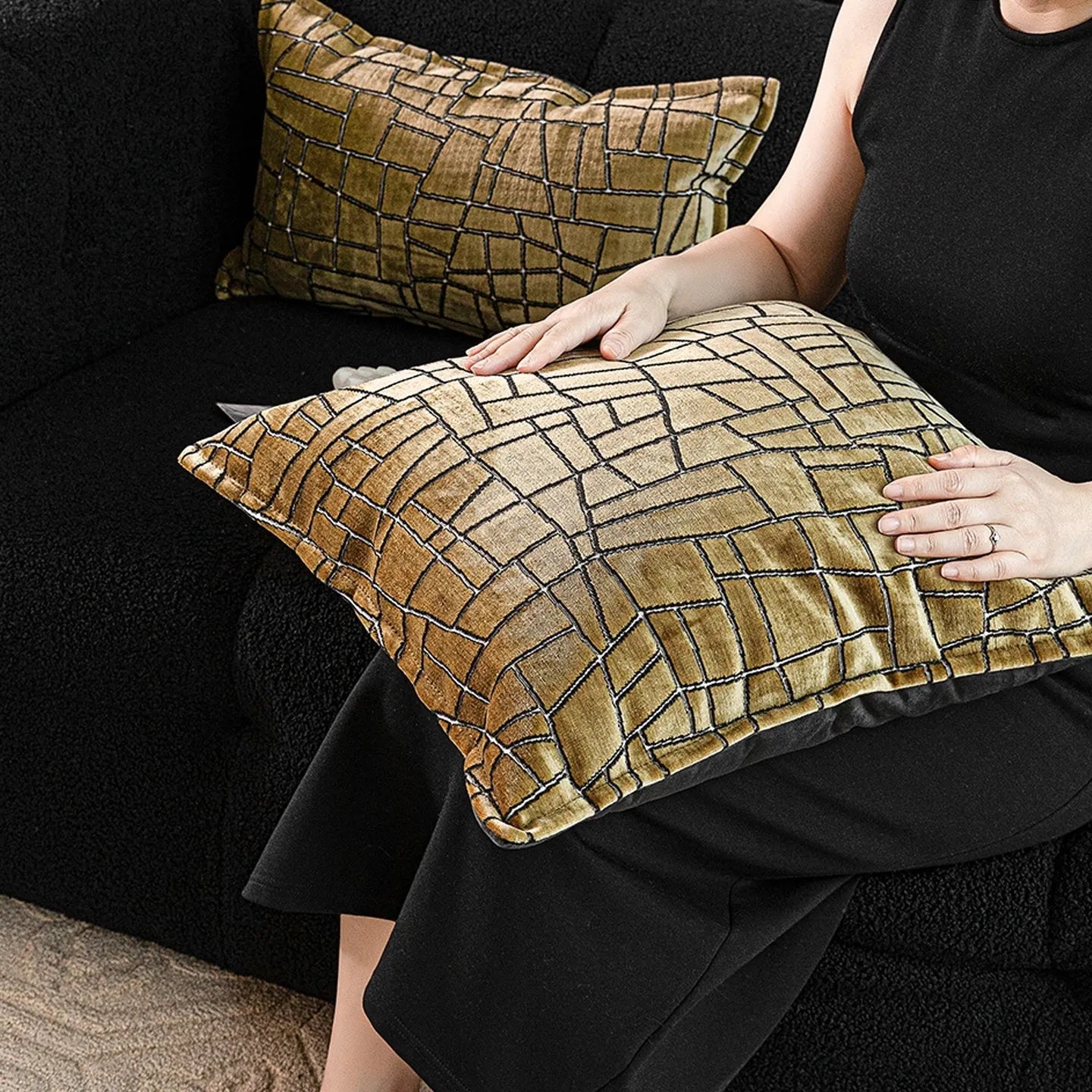 Gold geometric abstract pattern on square and rectangular polyester cushion covers.