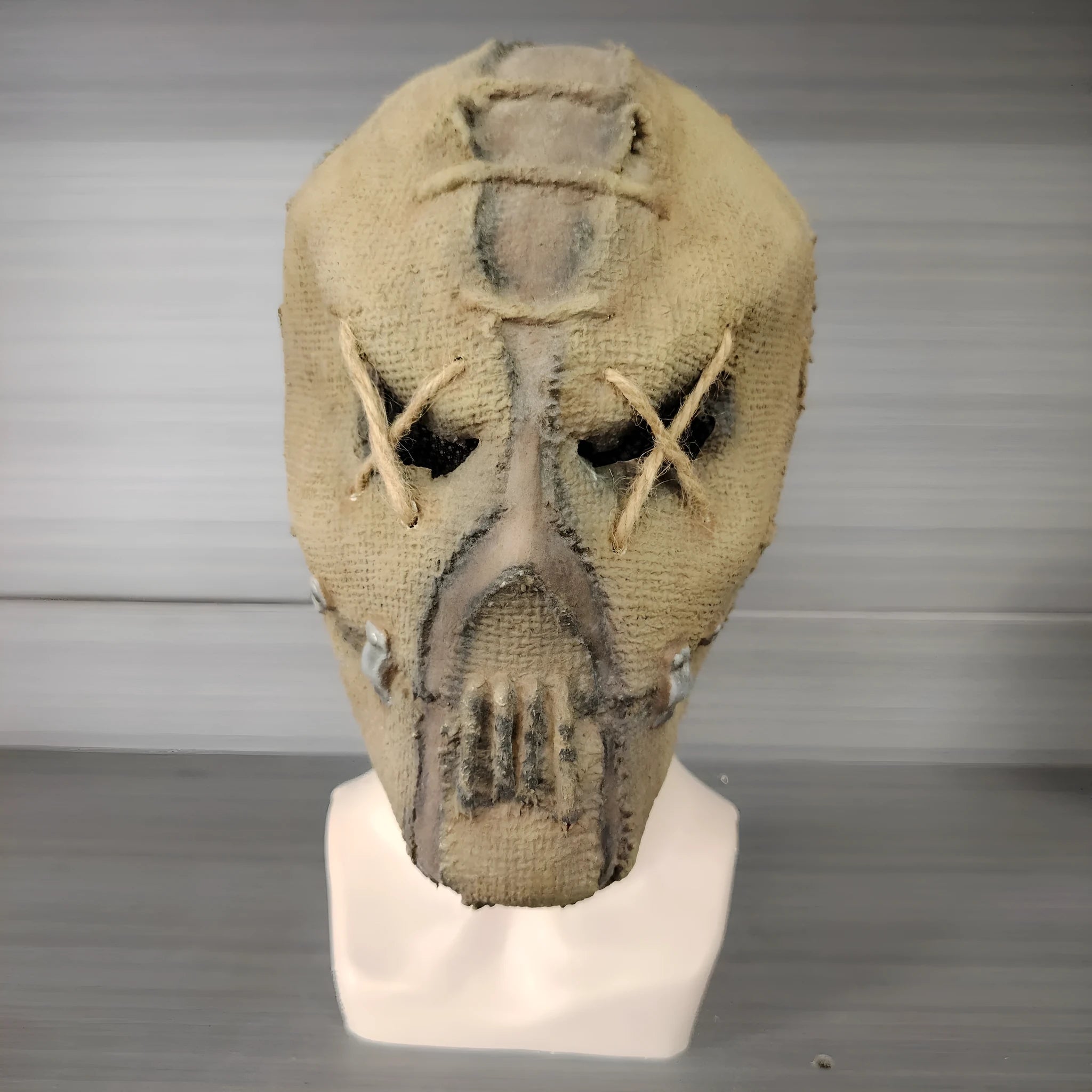 Latex Halloween horror mask showing detailed scarred skull modelling