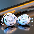 Black Bluetooth earphones with hanging ear design and USB charging cable