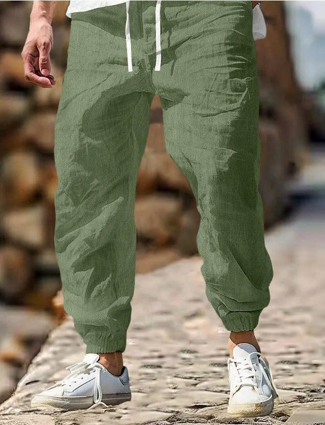 Men's straight-leg cotton trousers in apricot colour with an elastic waistband.