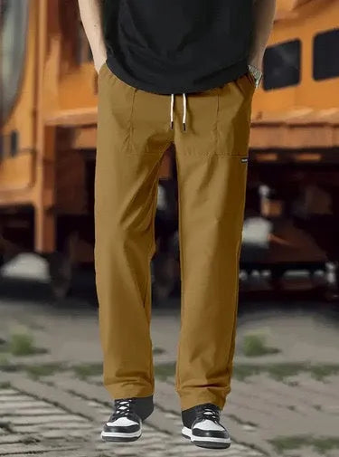 Men's lightweight polyester casual trousers in light grey colour shown flat