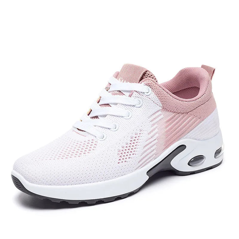 Women's pink Flyknit casual running shoes with mesh lining and flat PVC sole.