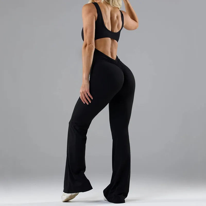 Women's black seamless yoga bodysuit jumpsuit with hollow out design and mid waist