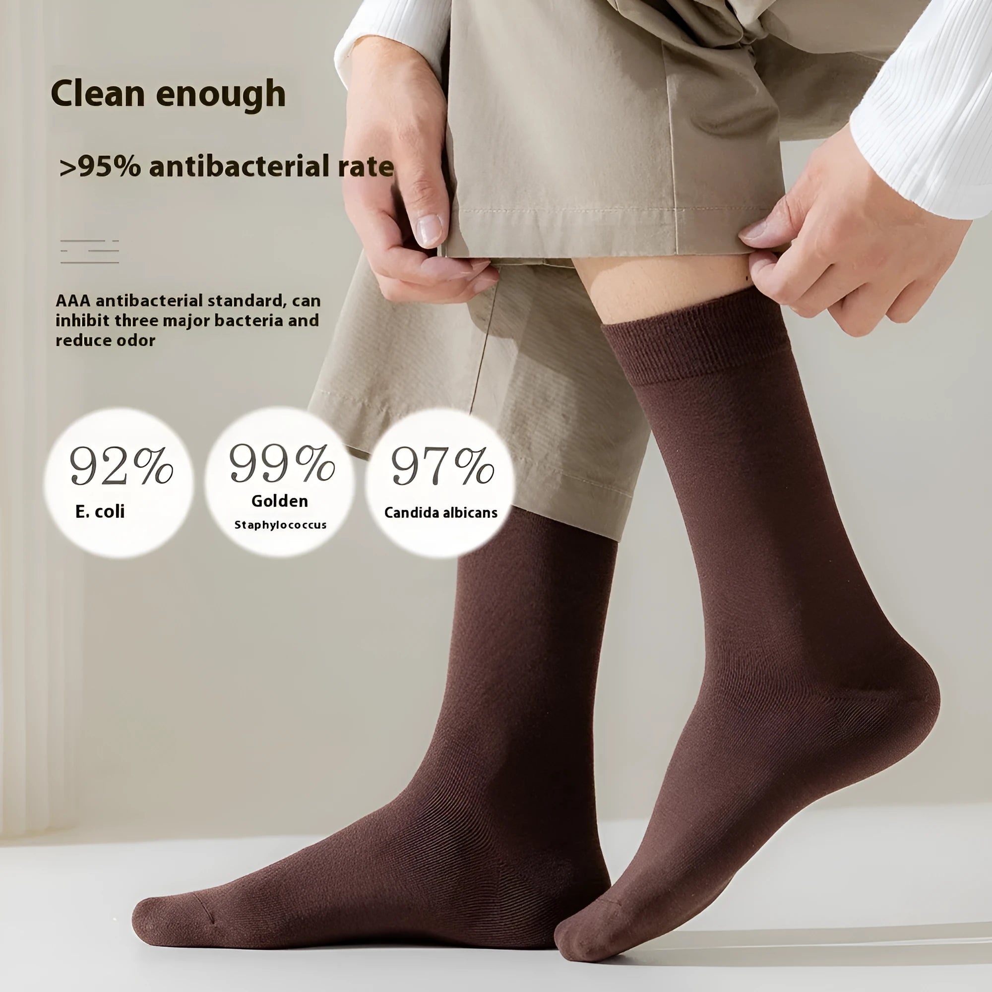 Mid-calf men's socks in solid colours made from combed cotton, shown in a stack.