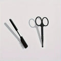 Black pet grooming brush with soft tear stain remover and comb attachment for dogs and cats