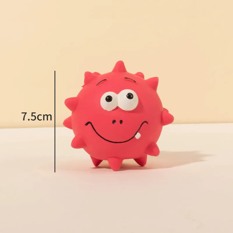 Four colourful squeaky dog balls with cute faces on natural latex rubber with bumpy dental-cleaning surface