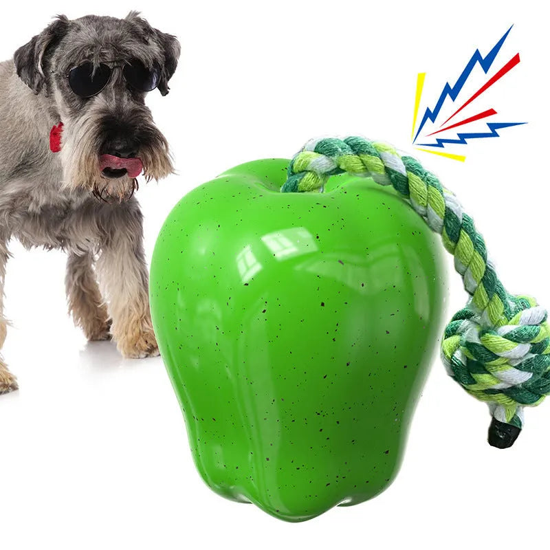 Green plastic Apple-shaped dog chew toy with hollow centre for food dispensing